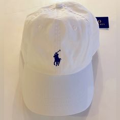 -Brand New With Tags -100% Cotton, Eyelet Vents, Adjustable Strap, Logo Embroidered - White, With Pony Logo White. One Size White Cotton Baseball Cap Flat Bill, Casual White Dad Hat With Flat Bill, White Six-panel Hat With Embroidered Logo, Classic White Cotton Baseball Cap, Classic White Dad Hat, White Cotton Flat Bill Hat, White Dad Hat With Embroidered Logo For Spring, Casual White Baseball Cap With Embroidered Logo, White Casual Dad Hat With Embroidered Logo