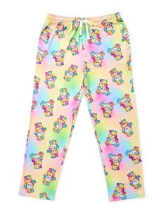 Show off your cute and cuddly style with these officially licensed Care Bears Lounge Pants. These soft pants feature Togetherness Bear's Pastel coloring and are perfect for relaxing all day long. Officially licensed Exclusively at Spencer's Elastic waistband Front pockets Drawstring closure Material: Polyester Care: Machine wash Imported Care Bear Pajama Pants, Carebear Pajamas, Playful Cotton Sweatpants For Loungewear, Playful Sweatpants With Elastic Waistband For Loungewear, Playful Relaxed Fit Sweatpants For Loungewear, Casual Sweatpants With Elastic Waistband For Pajama Party, Casual Multicolor Sleepwear With Elastic Waistband, Casual Relaxed Fit Bedtime Pants, Casual Relaxed Fit Pants For Bedtime