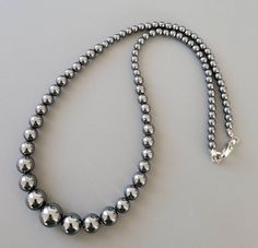 "Materials: lustrous Hematite beads - Graduated from 10mm to 4mm - silver lobster clasp - Length:  17\", will attach 2\" extending chain based on request." Elegant Silver Hematite Beaded Necklaces, Silver Hematite Beaded Necklace With Polished Beads, Silver Hematite Round Beads Jewelry, Silver Hematite Jewelry With Round Beads, Silver Hematite Gemstone Beaded Necklaces, Silver Hematite Beaded Necklace With Gemstone Beads, Silver Hematite Gemstone Beaded Necklace, Silver Hematite Necklace With 8mm Beads, Silver Hematite Necklace With Gemstone Beads