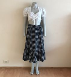 "Dirndl Skirt Black White Polka Dot Skirt Ruffled Dirndl Skirt High Waist Cotton Size label: 40 Measurements(lying flat): Length: 31\"/ 79 cm Waist: 13 3/4\"/ 35 cm (lying flat)  Please check measurements to insure a proper fit. Remember to allow yourself some extra room for movement. You can compare these with something from your closet that fits you well. Please convo me if you need additional measurements. Condition: great Vintage Condition Material:100%cotton. Lining:100%acetat N.B. Color ma Polka Dot Lined Midi Skirt, Flowy Polka Dot Midi Skirt, Casual Ruffled Polka Dot Skirt, Casual Polka Dot Ruffled Skirt, Casual Polka Dot Tiered Skirt, Polka Dot Ruffled Flowy Skirt, Polka Dot Ruffled Skirt For Summer, Flowy Polka Dot Skirt With Ruffles, Polka Dot Lined Summer Skirt