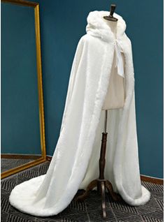 a mannequin with a white coat on it