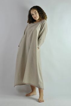 This is our no. 52 of Conscious Clothing Concept. This beautiful beige A-line loose fitting kaftan dress is made of pure quality linen. It is very comfortable to wear around the house or as the night dress. It works well as the summer beach dress protecting from the sun. It has got two pockets on the sides. Top and the bottom of the dress is machine embroided. It is the ultimate fabric for hot weather as it breathes and absorbs moisture better that any fabric on earth. Please write if you need d Beach Dresses With Pockets In Khaki, Khaki Beach Dresses With Pockets, Beige Kaftan For Spring Daywear, Beige Unlined Dress For Daywear, Oversized Long Beige Dress, Bohemian Linen Loungewear Dresses, Oversized Beige Tunic For Spring, Beige Tunic Dress For Loungewear, Beige Cotton Kaftan For Spring