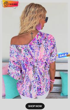 Pink Loose Painted Floral Tee Beach Blouse With Graphic Print, Purple Short Sleeve Vacation Tops, Purple Short Sleeve Top For Vacation, Vacation V-neck Blouse With Graphic Print, Purple Graphic Print Tops For Vacation, Pink V-neck Vacation Shirt, Pink V-neck Shirt For Vacation, Purple V-neck Summer Shirt, Graphic Print V-neck Blouse For Day Out