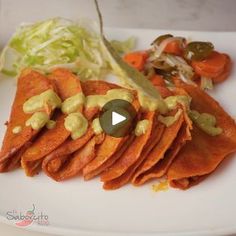 a white plate topped with meat and veggies