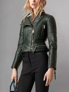 Elevate your biker chic look with the Women Lambskin Stylish Motorcycle Green Leather Jacket. This jacket is a perfect blend of edgy style and luxurious comfort, designed to make you stand out in any crowd. Crafted from premium lambskin leather, this jacket features a stunning green hue that adds a pop of color to your wardrobe. The soft and supple leather not only feels luxurious against your skin but also provides durability, ensuring that this jacket will be a staple piece in your wardrobe for years to come. The standout feature of this jacket is its stylish motorcycle-inspired design. With its asymmetrical zipper closure, quilted shoulder panels, and zippered pockets, this jacket exudes urban sophistication and edgy flair. Whether you're hitting the open road on your motorcycle or simp Luxury Winter Biker Jacket With Zipper Closure, Luxury Leather Jacket With Zipper For Fall, Luxury Fitted Biker Jacket For Winter, Luxury Fitted Long Sleeve Biker Jacket, Green Moto Leather Jacket With Long Sleeves, Green Biker Leather Jacket For Fall, Luxury Fall Biker Jacket With Zipper Closure, Luxury Biker Jacket With Zipper Closure For Fall, Luxury Biker Jacket With Zipper For Fall