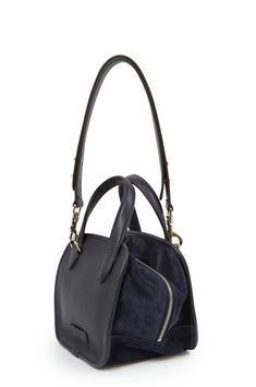 Designed and handcrafted in Italy, La Sophia bag combines leather and suede for a contemporary yet timeless piece. Complete with an adjustable, removable strap and internal pockets this bag gives you versatility and style. Details 8 1/2" H x 8 1/2" W x 7 1/2 D Handle drop: 4" Strap drop: 12"- 20" (adjustable) Handmade in Italy from leather and suede partially lined in canvas Silver hardware 2 internal pockets, 1 with zipper EXCHANGE ONLY La Sophia Bag - D/1017/CR Suede Satchel With Detachable Handle, Modern Suede Bag With Detachable Handle, Suede Satchel With Detachable Strap, Navy Bag With Detachable Double Handle, Navy Bags With Detachable Double Handle, Modern Suede Satchel For Daily Use, Suede Satchel With Top Carry Handle For Travel, Suede Shoulder Bag With Handle Drop For Daily Use, Navy Shoulder Bag With Top Carry Handle For On-the-go