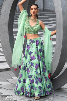 Sea green lehenga with all over geometric floral print and embroidered waistband. Paired with blouse with all over floral bead, cut dana, sequin work and organza dupatta with fringe drop tassels.
Components: 3
Pattern: Printed and Embellished
Type Of Work: Geometric Floral Print, Bead, Sequin and Cut Dana Work
Neckline: V Neck
Sleeve Type: Sleeveless
Fabric: Crepe, Soft Net, Organza, Lining: Shantoon
Color: Green
Other Details: 
Length:
Lehenga: 43 inches
Blouse: 15 inches
Cut work back
Scallope Green Floral Print Dupatta For Reception, Festive Green Lehenga With Floral Print, Festive Green Floral Print Lehenga, Designer Green Floral Print Lehenga, Green Floral Print Lehenga With Traditional Drape, Designer Green Floral Lehenga, Green Lehenga With Floral Print And Traditional Drape, Traditional Green Floral Print Lehenga, Green Floral Print Lehenga For Wedding