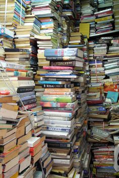 a large stack of books stacked on top of each other