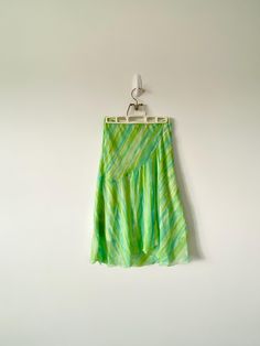 vintage sheer y2k skirt by brand wrapper in great pre-owned condition  y2k 2000 style skirt that hits below the knee bright green and blue  made in usa, marked size medium 13" wide flatlay waistline that stretches all the way to 18" wide mesh midi y2k maxi skirt  00's vintage sheer skirt by wrapper | vintage 2000 fashion skirt | sheer striped green and blue long length knee skirt | y2k skirt Y2k Long Skirt For Summer, Y2k Style Long Summer Skirt, Y2k Long Summer Skirt, Green Y2k Mini Skirt, Green Midi Skirt For Summer, Green Y2k Style Summer Skirt, Green Y2k Style Skirt, Green Y2k Summer Skirt, Y2k Green Skirt