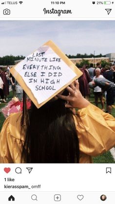 a person wearing a graduation cap with writing on the back of their head in front of a group of people