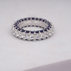 Round Band Ring, Moissanite Band, Full Eternity Band, Women's Wedding Ring, Bridesmaid Gift, Anniversary Band Blue Sapphire, Vintage Ring. These 925 sterling silver Beautiful white classical round diamond and blue sapphire white and blue is a symbolized of western look . These full eternity white ring band is suitable for all types of skin tones all types of customization are available we make these as per the requirements.  these band ring is made out by our experience craftsman . all types of White Sapphire Ring With Halo Setting For Wedding, White Sapphire Wedding Ring With Prong Setting, Silver Cubic Zirconia Eternity Band For Wedding, Silver Cubic Zirconia Eternity Wedding Band, Round Diamond Cut Sapphire Wedding Ring, White Sapphire Ring For Wedding, Fine Jewelry, White Sapphire Wedding Ring In Fine Jewelry Style, White Cubic Zirconia Sapphire Ring With Diamond Cut, Round Sapphire Wedding Ring With Diamond Cut