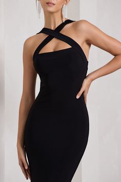 Carefully cut in a premium stretch jersey that clings to each curve. this black maxi dress is as flattering as it is flawless. Detailed by delicately criss-crossing straps. Cross My Heart is the epitome of understated glamour. For the perfect wedding guest look. try complimenting this halter-neck dress with a sleek bun and gold accents. Features - Premium stretch jersey- Crossed halter neckline- Sleeveless- Bum ruching- Maxi length Sizing & Fit Model is 5'7" and wears UK size 8 / US size 4 Product Information Designed exclusively by Club L London Double layered with good stretch Premium jersey in Black (95% Polyester. 5% Elastane) 155cm total length SKU: CL130020002 Black Backless Elastane Maxi Dress, Fitted Cross Back Maxi Dress For Night Out, Date Night Halter Neck Maxi Dress With Crisscross Straps, Fitted Cross Back Maxi Dress For Party, Elegant Fitted Strappy Halter Dress, Chic Cross Back Maxi Dress For Night Out, Black Stretch Halter Maxi Dress, Black Stretch Mini Dress With Crisscross Straps, Fitted Halter Dress With Crisscross Straps