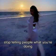 a woman standing on top of a sandy beach next to the ocean at sunset with an inspirational quote