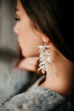 Minimal simplicity. Pure earrings made of a preserved plants. What are preserved plants and flowers? https://www.etsy.com/shop/LaviAccessories#faq Check the other items of INIMINIMA series: - earrings: https://etsy.me/3fJ5cVK - half wreath: https://etsy.me/3hV2EGY Each item is possible to be customized upon your wish. Each item is unique, handmade and therefore never absolutely the same as the image preview(s). Some parts of the items (e.g. seasonal dried flowers, thistles or berries) may not be Half Wreath, Mountain Earrings, Floral Comb, Custom Bouquet, Colorful Bouquet, Bridal Comb, Plants And Flowers, Bridal Hair Pins, Earrings Wedding