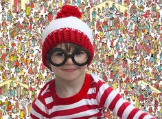 a young boy wearing glasses and a knitted hat