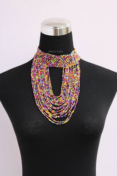 Beaded choker necklace, Beaded women jewelry, African boho necklace, Christmas gift for her, Moms gift, Fringe necklace, Tribal necklace An elegant necklace that can match any outfit. Handmade by the Maasai women in Kenya using fine beads. Neck size: 14 inches Available in different colors Color: Rainbow 3-5 days delivery via DHL Express. Pay shipping fee for the first item only and additional items ship for free. To view more items in our shop, kindly click here: nkoroicrafts.etsy.com Adjustable Colorful Beaded Necklace For Festivals, Large Beads Festival Choker, Festival Gift Beaded Choker Necklaces, Festival Beaded Choker Necklace Gift, Adjustable Beaded Necklaces With Dangling Beads For Festivals, Festival Large Beads Choker, Adjustable Beaded Necklace With Dangling Beads For Festivals, Round Beaded Necklaces For Festivals, Bohemian Beaded Choker Necklace As Gift