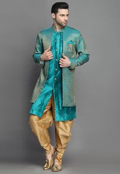 Art Brocade Silk and Art Silk Layered Sherwani in Teal BlueThis Readymade attire is Enhanced with Buttons. Crafted in Chinese Collar Neck and Full SleeveAvailable with an Art Silk Dhoti Pant in BeigeDo note: Brooch and Footwear shown in the image is for presentation purposes only. Half to one inch may vary in measurement. (Slight variation in actual color vs. image is possible) We sell all kinds of menswear. Mens Kurta | Mens Kurta Pajama | Mens Sherwani | Mens Sherwani Sets | Traditional Menswe Green Ceremonial Kurta For Navratri, Ceremonial Green Kurta For Navratri, Blue Long Sleeve Choli With Dupatta, Blue Long Sleeve Choli For Festive Occasions, Festive Blue Long Sleeve Choli, Festive Long Sleeve Blue Choli, Blue Bollywood Choli With Long Sleeves, Blue Bollywood Long Sleeve Choli, Blue Long Sleeve Choli With Zari Work