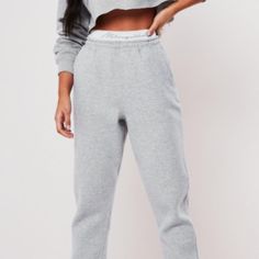 Missguided Gray Joggers, Tape Waistband And Side Pockets ~Size 8 ~Color Grey ~Gray Joggers ~Featuring A Missguided Tape Waistband And Side Pockets. ~Regular Fit Ankle Grazer - Sits On The Ankle Bone ~52% Polyester 48% Cotton ~Machine Wash Sporty Solid Bottoms With Logo Waistband, Casual Pants With Logo Waistband, Spring Bottoms With Logo Waistband, Playboy Sweatpants, Brown Sweatpants, Leather Jogger Pants, Gray Joggers, Fall Streetwear, Printed Jogger Pants