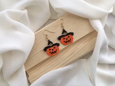 ➙Embrace the enchantment of Halloween with these handcrafted pumpkin earrings! Each meticulously designed and handcrafted pair captures the essence of the season, making them the perfect choice for Halloween parties, costume events, or simply immersing yourself in the spirit of the season.♥︎ ➙Key Features: - Handcrafted with precision using high-quality Miyuki beads. - Unique pumpkin designs that exude Halloween vibes. - Lightweight and comfortable for all-day wear. - Versatile, suitable for bot Halloween Beaded Earrings Patterns Free, Pumpkin Beaded Earrings, Handmade Costume Jewelry For Halloween, Spooky Handmade Earrings For Halloween, Handmade Spooky Halloween Earrings, Spooky Handmade Halloween Earrings, Handmade Dangle Halloween Jewelry, Handmade Spooky Earrings For Gift, Handmade Halloween Earrings Gift