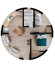 an overhead view of a bedroom and living room in a round house with wood flooring