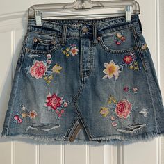 Women’s American Eagle Floral Patch Jean Skirt. Size 4. Never Worn- Excellent Condition! Tags Removed (Size Tag Removed As Well). Spring Mini Skirt With Floral Embroidery, Casual Floral Embroidery Skirt, Floral Embroidered Mini Skirt, Spring Skirt With Floral Embroidery, Casual Summer Mini Skirt With Floral Embroidery, High Rise Lined Skirt For Spring, Casual Embroidered Mini Skirt For Spring, Embroidered Blue Mini Skirt, Casual Blue Skirt With Floral Embroidery