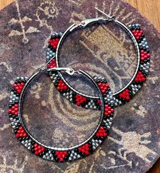 Beautifully beaded hoop earrings with Delica beads, using a Native diamondback pattern.  These earrings are hypoallergenic silver and are 2 inches in diameter. Beaded Small Hoop Earrings In Metal, Small Hoop Beaded Metal Earrings, Beaded Metal Hoop Earrings, Beaded Metal Small Hoop Earrings, Metal Hoop Earrings With Colorful Beads As Gift, Small Beaded Hoop Earrings In Metal, Small Beaded Metal Hoop Earrings, Colorful Beaded Round Metal Earrings, Nickel-free Metal Hoop Beaded Earrings