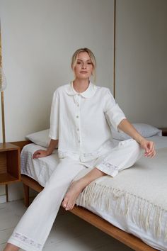 "Most adorable linen pajama set for women in white eco linen. The linen loungewear luxury with delicate cotton lace Nice trapeze style short jacket with Peter pan collar and long pants with delicate cotton lace decoration at jacket and pants bottoms. This stunning pajama you can buy as a wedding, birthday or anniversary gift. ITEM DETAILS: Jacket: - Short trapeze shape jacket - Buttoned down front - Peter Pan style collar - 3/4 length sleeves - Jacket back length - 23\" (58.5cm) - At jacket bott Cotton Pyjama Set Women, Lounge Wear For Women, White Summer Relaxation Sets, Summer Relaxation White Sets, White Feminine Sleepwear For Relaxation, Spring Linen Sleepwear For Home, White Linen Loungewear Sets, White Feminine Sleepwear With Relaxed Fit, White Relaxed Fit Sets For Daywear