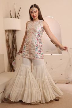 Ivory base short kurta with multicolor thread and gota work embroidery in floral pattern. Paired with tiered sharara and an embroidered dupatta in cutout hem border. - Aza Fashions Kurta Sharara Set, Kurta Sharara, Short Kurta, Gota Work, Women Kurta, Embroidered Dupatta, Straight Kurta, Sharara Set, Set Women