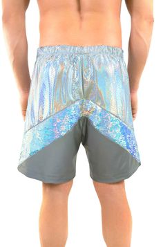 Get Thunderstruck in the White Lightning mens sequin shorts. This pair of reflective mens rave shorts has an elastic waistband and two side zipper pockets to ensure your stuff stays safe while you’re having fun. This style features 3 panels:one white holographic snakeskin print spandex panel, one iridescent flip sequin panel, and one in our signature silver Photobomber fabric that reflects light and glows in flash photography or when the light hits it. These ethically made mens festival shorts a Eco Swimwear, Rave Shorts, White Holographic, Rave Festival Outfits, White Lightning, Festival Shorts, Sequin Shorts, Rave Festival, Flash Photography