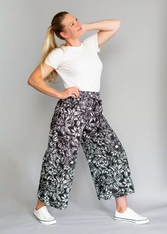 The Flora Array Pants are fitted floral pants, high-waisted and with a flattering wide-leg silhouette that creates a modern comfy look. They are a statement style made from lightweight cotton-linen blend fabric. The removable tie belt can be added to highlight the waist and ensure a more secure fit. These pants feature a cropped length and seam line pockets.  Flora Array is a unique hand-painted print, inspired by Australia and the country's beautiful native flora. The item is consciously made in New Zealand, with environment and sustainability in mind, in limited runs. It has also been pre-washed to ensure it arrives at your doorstep with softer feel and fresh scent. These wide-leg pants look great with white top and sneakers for a simple timeless look. Or mix colours and textures by pair High-waisted Floral Print Wide Leg Lounge Pants, Floral Print Wide Leg Loungewear Pants, Stretch Wide-leg Floral Print Pants, Stretch Wide-leg Pants With Floral Print, Stretch Floral Print Wide-leg Pants, Floral Print Wide Leg Relaxed Fit Pants, Floral Print High-waisted Wide Leg Pants For Work, Relaxed Fit Wide Leg Pants With Floral Print, Relaxed Fit Wide Leg Floral Print Pants