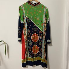 "Authentic 1960s Paganne knee length long sleeve dress with ultra rare Tree Off Life design in a beautiful bold color palette  Zipper back with hook and eye high neck closure  no fiber tags Measurements taken flat double when necessary Shoulder to shoulder 14\" Pit to pit 16\" Waist 14\" Pit to hem 35\" Due to the nature of vintage, all items in my store are sold as is. All sales are final without exception, I have a no returns/refunds policy. However, please contact me if there is a problem wit Green Long Sleeve Dress With Colorful Pattern, Multicolor Long Sleeve Dress With Vintage Print, Multicolor Long Sleeve Dresses With Vintage Print, Patterned Long Sleeve Dress With Graphic Print, Bohemian Long Sleeve Dress With Graphic Print, Long Sleeve Bohemian Dress With Graphic Print, Multicolor Abstract Print Long Sleeve Dress, Long Sleeve Multicolor Abstract Print Dress, Multicolor Long Sleeve 70s Inspired Dress