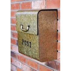 a metal mailbox mounted to a brick wall with the word post written on it