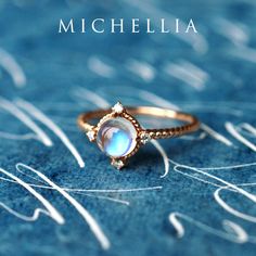 "Our current turnaround time for regular orders is 6-8 weeks. For urgent orders, please shop our Ready-to-Ship collection below (7-10 business days): https://michellia.com/collections/ready-to-ship (please copy and paste into browser) -------- 「Stella」- Aura of Galaxy Ring, in Moonstone Traveled through moons and stars, our galaxy-inspired \"Stella\" is designed to remind us of the infinite possibilities in our incredible universe. The focal iridescent gem is surrounded by four pieces of genuine Ethereal Oval Moonstone Ring, Moon Phase Diamond Rings As Gift, Promise Moonstone Ring With Rose Cut Diamonds, Formal Moonstone Ring With Gemstone Accents, Celestial Moon-shaped Jewelry With Rose Cut Diamonds, Celestial Moon Shaped Jewelry With Rose Cut Diamonds, Ethereal Jewelry With Rose Cut Diamonds And Moonstone, Celestial Moonstone Promise Ring, Ethereal Moonstone Jewelry With Rose Cut Diamonds