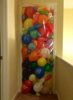 there is a bunch of balloons in the hallway