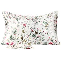 two pillows with floral print on them, one is white and the other is red