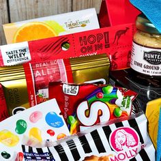 an assortment of candy and snacks in a basket