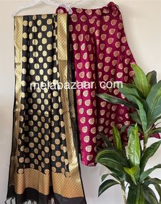 Soft and flowy Banarsi satin silk lehenga/skirt with a big flare and a coordinating Banarsi dupatta. Skirt length: 40 inches. Skirt waist: fits up to 38 inches. Dupatta: 96 by 34 inches. Color: Black and Wine Floor-length Banarasi Silk Sharara For Festive Occasions, Black Art Silk Lehenga With Cutdana, Black Cutdana Art Silk Lehenga, Festive Black Art Silk Lehenga, Festive Black Dola Silk Lehenga, Traditional Satin Saree Set, Party Set With Long Skirt And Dupatta, Anarkali Style Art Silk Lehenga, Black Art Silk Lehenga For Eid