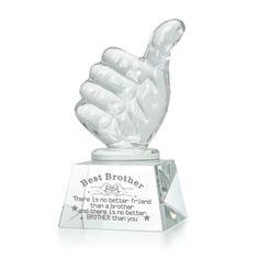 a clear glass award with a hand holding the word best brother on it's base