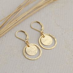 This unique pair of Textured Gold Circle Lever-Back Earrings are handcrafted for you with great care from high-quality 14K Gold Filled the earring is lightweight, simple, and pretty. Hand-hammered open circles and discs make each pair one of a kind. Lever-back ear wires make the earrings extremely convenient to wear. They are perfect for everyday wear and will be a great addition to your jewelry collection.  MATERIALS AND SIZE ◆ Metal - 14K Gold Filled ◆ Earrings measure approx. 34 mm/ 1.34 inch Disc Earrings, Gold Circle, Gold Filled Earrings, Lightweight Earrings, Light Weight Earrings, Gold Texture, Gold Filled Jewelry, Niagara Falls, Jewelry Gift