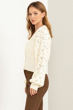 This cardigan is designed to make your days even more delightful. The exquisite pointelle knit detail adorns the entire piece, adding a touch of intricate charm. The button-front bodice exudes timeless elegance and is framed by a classic V-neckline that flatters your neckline. The ribbed cuffs and hem provide a finishing touch, enhancing the overall texture and fit of the cardigan. Model is wearing a smallModel SpecsHeight: 5'9"Bust: 34"Waist: 24"Hips: 35" Fabric Contents: 79% Polyester 21% Acry Chic Pointelle Knit Cardigan For Layering, Classic Open Knit Sweater For Spring, Elegant Pointelle Knit Cardigan For Spring, Elegant Pointelle Knit Spring Cardigan, Chic Button-up Cardigan In Pointelle Knit, Chic Button-up Pointelle Knit Cardigan, Elegant Open Knit Sweater For Spring, Chic Button-up Cardigan With Pointelle Knit, Feminine Spring Cardigan With Pointelle Knit