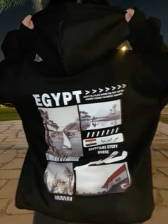 the back of a man's black hoodie with egyptian symbols and images on it