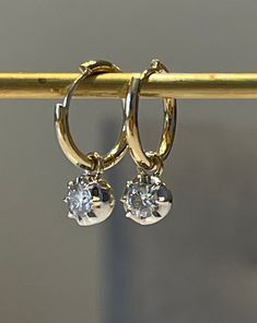 "Lower prices on our main website: https://discomarshmallow.myshopify.com/ A pair of beautiful hoop earrings with round shaped moissanites. In Georgian cut-down settings, the round moissanite Hoop earrings are handcrafted in white and yellow gold, on small yellow gold hoops.  Item Details * Made to Order. * Gold Kt: 14K or 18K Solid Gold * Custom Gold Color: Rose Gold, Yellow Gold, White Gold * Cut: Round * Setting Type: Georgian * Ready to Ship in 20-30 business days If you are interested in a Classic Dangle Huggie Earrings With Diamond Accents, Gold Hoop Earrings With Single Diamond, Diamond White 14k Gold Hoop Earrings, 14k Gold Diamond White Hoop Earrings, Classic Round Hoop Earrings With Single Diamond, 14k Gold Hoop Earrings With Single Diamond For Anniversary, 14k Gold Hoop Earrings With Single Diamond, 14k Gold White Hoop Earrings, 14k Gold Hoop Earrings With Diamond Accents