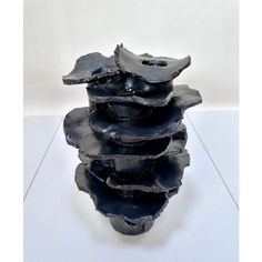 a stack of black rocks sitting on top of each other