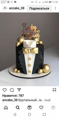 a black and white cake with gold decorations