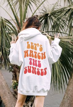 Let's Watch The Sunset Hoodie Trendy Hoodie Aesthetic Sweatshirt Preppy Sweatshirt Oversized Hoodie Preppy Clothes Aesthetic Clothes HOODIE INFO/CARE: * 50% cotton, 50% polyester * Pre-shrunk * Unisex, Loose fit * 1x1 athletic rib knit collar with spandex * Air-jet spun yarn with a soft feel and reduced pilling * Double-needle stitched collar, shoulders, armholes, cuffs, and hem * Wash inside out in COLD water * Lay flat to dry or machine dry on LOWEST setting * Do NOT iron * Do NOT dry clean Pr Vsco Style Relaxed Fit Sweatshirt With Letter Print, Vsco Style Hoodie Sweatshirt With Letter Print, Vsco Style Long Sleeve Hoodie With Letter Print, Oversized White Hip Hop Sweatshirt, Winter Vsco Hoodie With Letter Print, White Cotton Vsco Sweatshirt, Vsco Style Graphic Print Relaxed Fit Sweatshirt, Trendy Oversized White Hoodie, Oversized Hooded Sweatshirt For Leisure