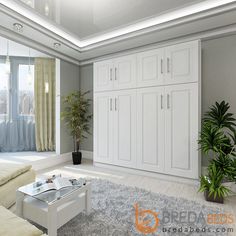 a living room filled with furniture and a chandelier hanging over the top of it