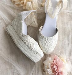 *Handcrafted Caroline luxe espadrilles in pretty lace for a sweet & romantic statement. *Made of delicate chantilly lace in pale ivory color *Unique Wedge heel made of natural jute traditionally handwoven in white color. *Rubber sole. .Lace Ribbon in ivory color matching the upper. *Heel measures : 4 inches ( 10 cm ) *Traditionally handmade in Spain. -SIZE: Contact us if you have any questions about sizes. Spring Beach Wedding Closed Toe Shoes, Beige Summer Wedding Shoes With Round Toe, Spring Wedding Shoes In Cream Lace, Spring Wedding Shoes With Round Toe, Cream Lace Wedding Shoes For Spring, Spring Cream Lace Wedding Shoes, Beach Wedding Shoes With Round Toe For Summer, Round Toe Wedding Shoes For Beach Wedding In Summer, Round Toe Wedding Shoes For Beach Wedding