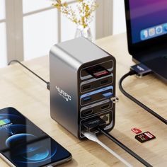 an external hard drive is plugged in to the charger on a desk next to a laptop