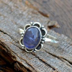 Natural Iolite Gemstone Ring -Bezel Set Designer Ring -Birthday Gift -Iolite Cabochon Ring-925 Sterling Silver Ring- Yellow Gold Iolite Ring Size/Dimension (Approx) : All Sizes Available Gemstone : Iolite Stone Shape : Oval Stone Size (Approx) : 9 x 7 mm Stone Color : Blue Please Note - Because you use good quality hand-selected gemstones Therefore, Colors and Inclusions of the Stone may Vary. I will Choose a Gorgeous Stone for You. Please Convo Us For Gemstone Customization. WHOLESALE PRICE JEW Sapphire Cabochon Ring For Anniversary, Gift Bezel Set Oval Cabochon Amethyst Ring, Oval Cabochon Amethyst Ring With Bezel Setting As Gift, Amethyst Cabochon Ring In Sterling Silver For Anniversary, Cabochon Amethyst Ring In Sterling Silver For Anniversary, Anniversary Cabochon Amethyst Ring In Sterling Silver, Iolite Jewelry, Iolite Stone, Ring Bezel