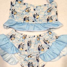 Excellent Used Condition, No Stains, No Rips, No Loose Threads Childrens / Infants Size Xs 12-18 Months Top Only Worn Once, Bottom Never Worn Cute Ruffled Swimwear For Poolside, Playful Blue Swimwear For Vacation, Sleeveless Blue Sets For Beach Season, Cute Summer Tankini For Playwear, Playful Blue Tankini For Swimming, Cute Summer Tankini For Casual Wear, Blue Cartoon Print Swimwear For Play, Playful Ruffled Tankini For The Pool, Playful Ruffled Tankini For Pool